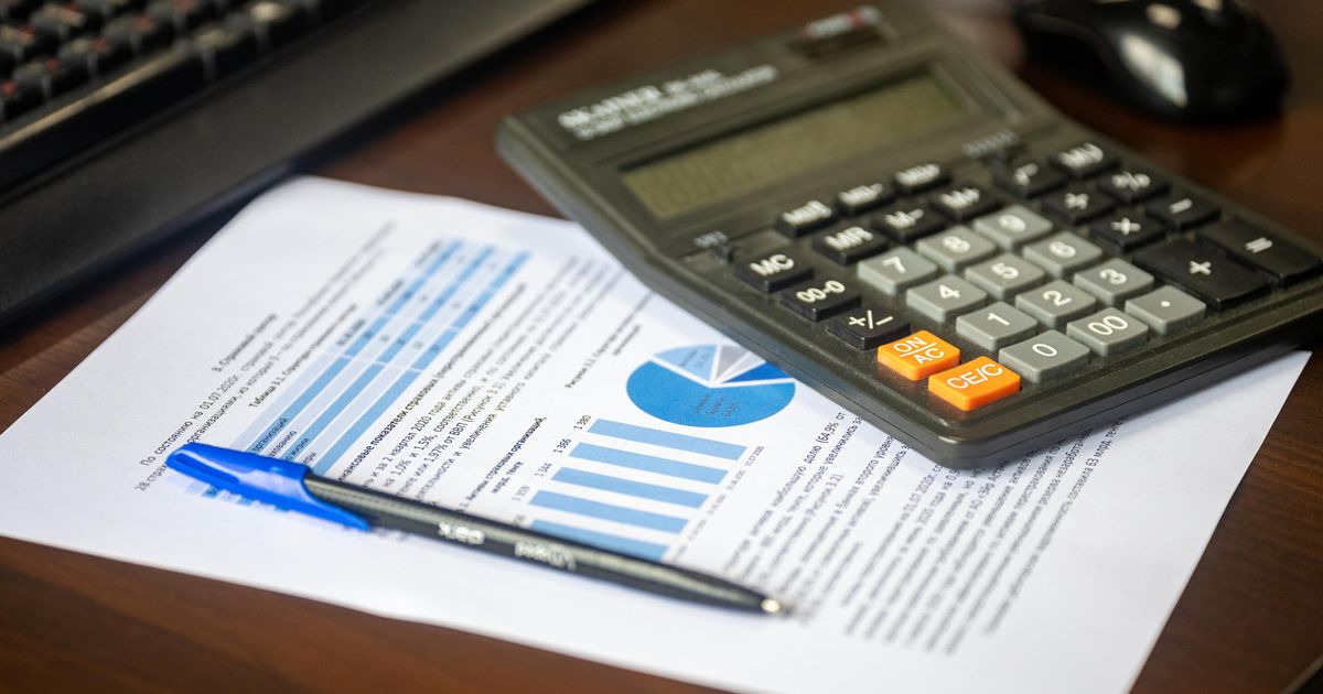 Calculator and financial documents for estimating Medicare costs